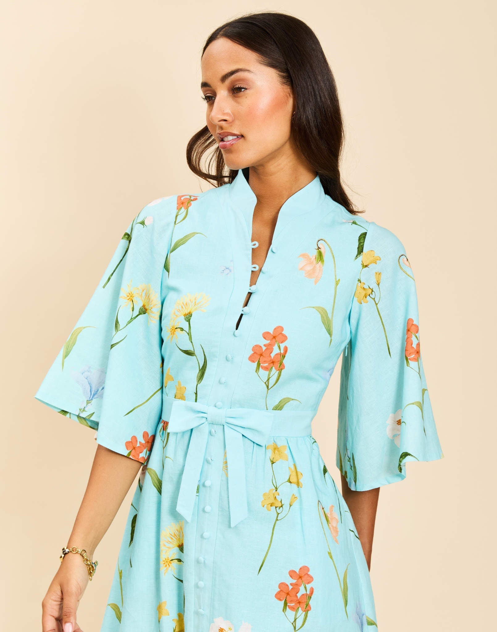 Carmen Midi Dress in Garden Waltz linen with mandarin collar, butterfly sleeves, bow waist detail, and fit-and-flare silhouette.