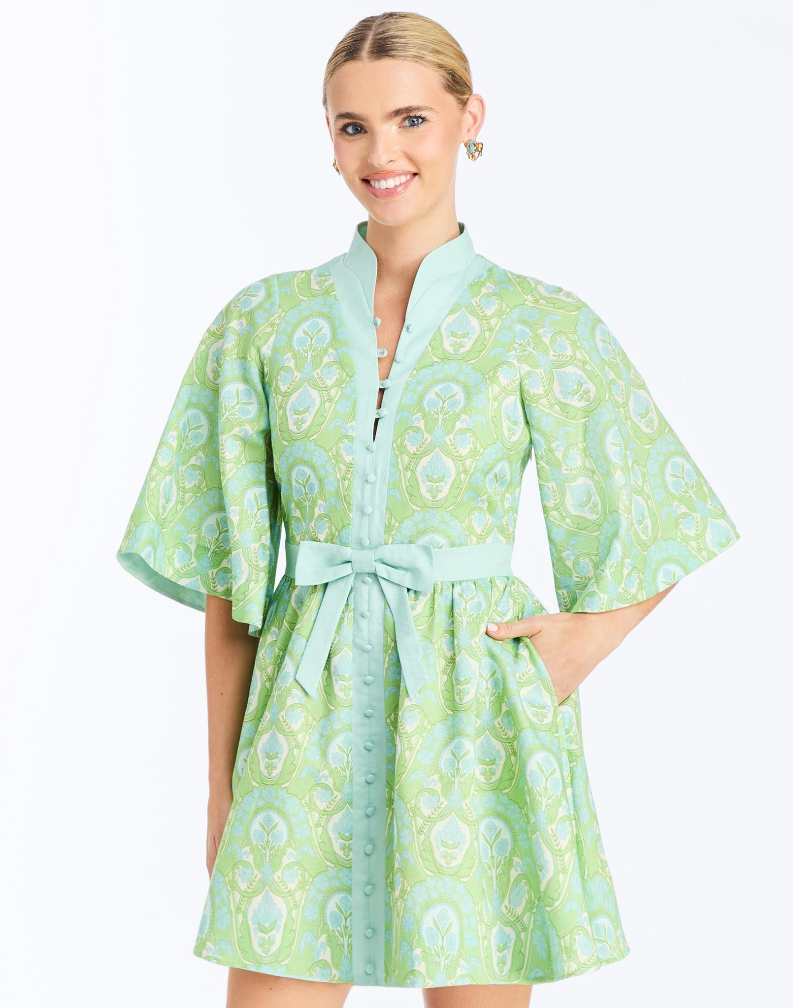 Front - Carmen Mini Dress in Trellis Verte is a printed linen mini with mandarin collar, butterfly sleeves, and waist bow.