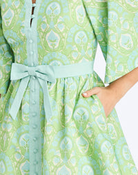 Detail - Carmen Mini Dress in Trellis Verte is a printed linen mini with mandarin collar, butterfly sleeves, and waist bow.