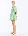 Side - Carmen Mini Dress in Trellis Verte is a printed linen mini with mandarin collar, butterfly sleeves, and waist bow.
