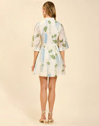 Carmen Mini Dress in Wisteria Toile featuring mandarin collar, butterfly sleeves, bow waist detail, and fit-and-flare mini silhouette.