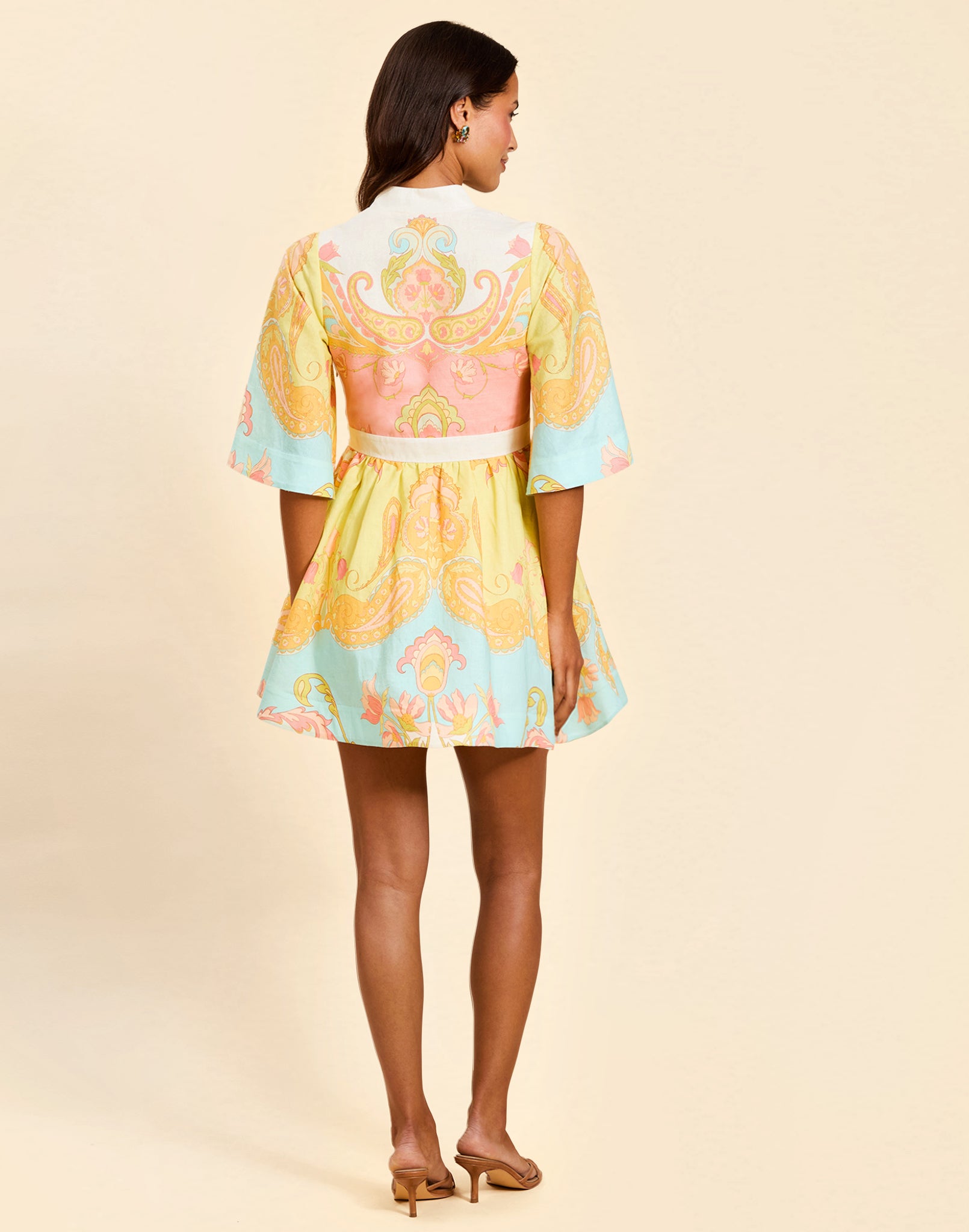 Carmen Mini Dress in Venetian Paisley linen with butterfly sleeves, mandarin collar, and bow waist detail.