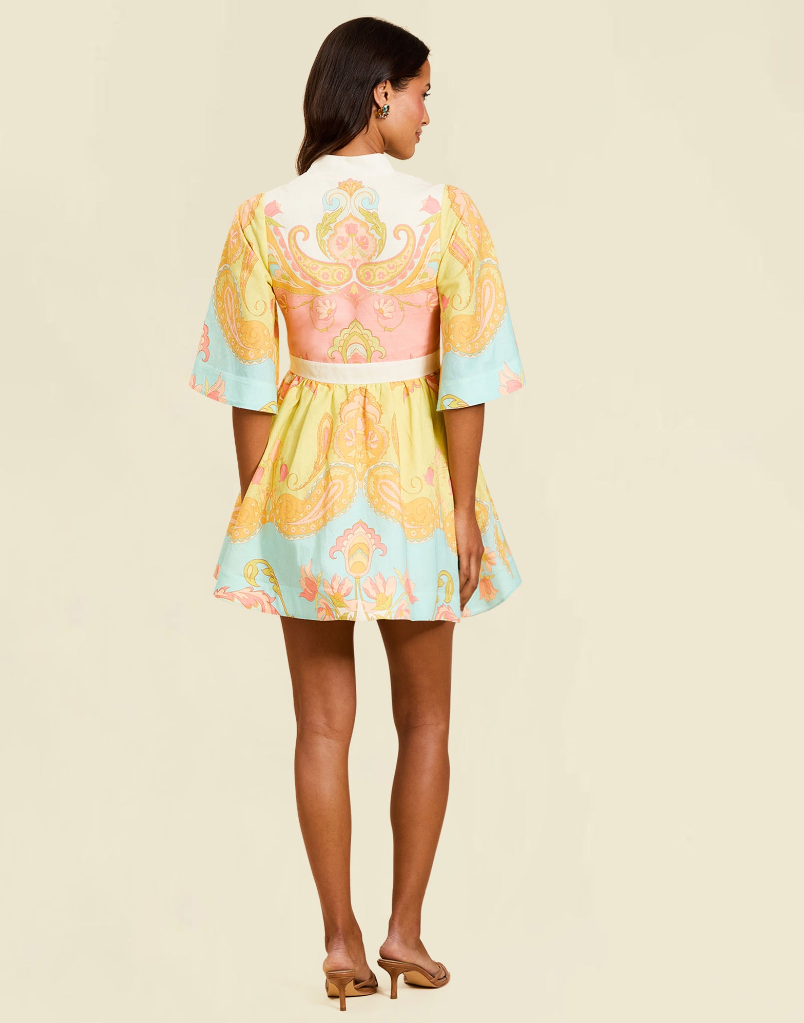 Carmen Mini Dress in Venetian Paisley linen with butterfly sleeves, mandarin collar, and bow waist detail.