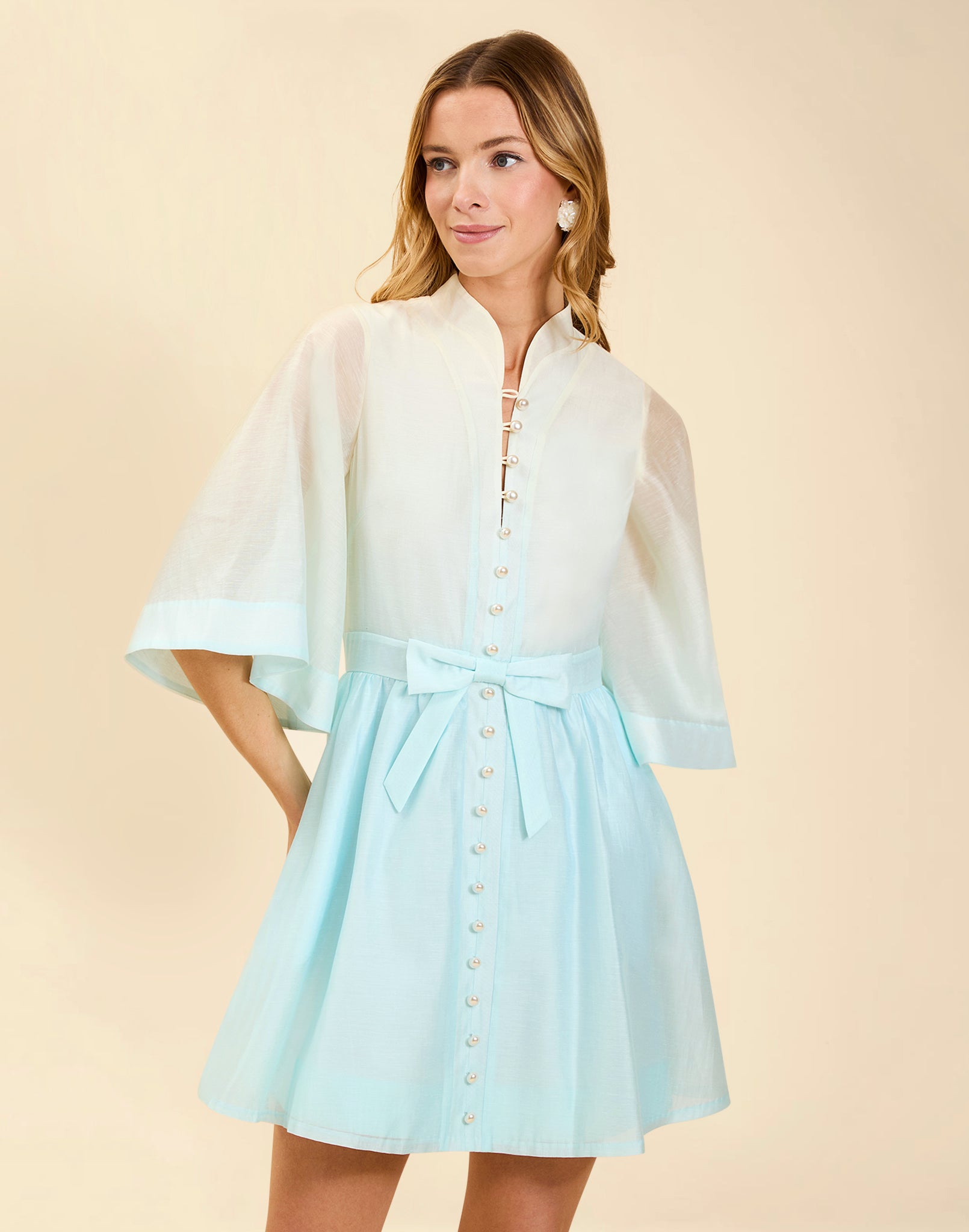 Carmen Mini Dress in Powder Ombré linen organza with mandarin collar, butterfly sleeves, bow waist detail, and fit-and-flare mini silhouette.