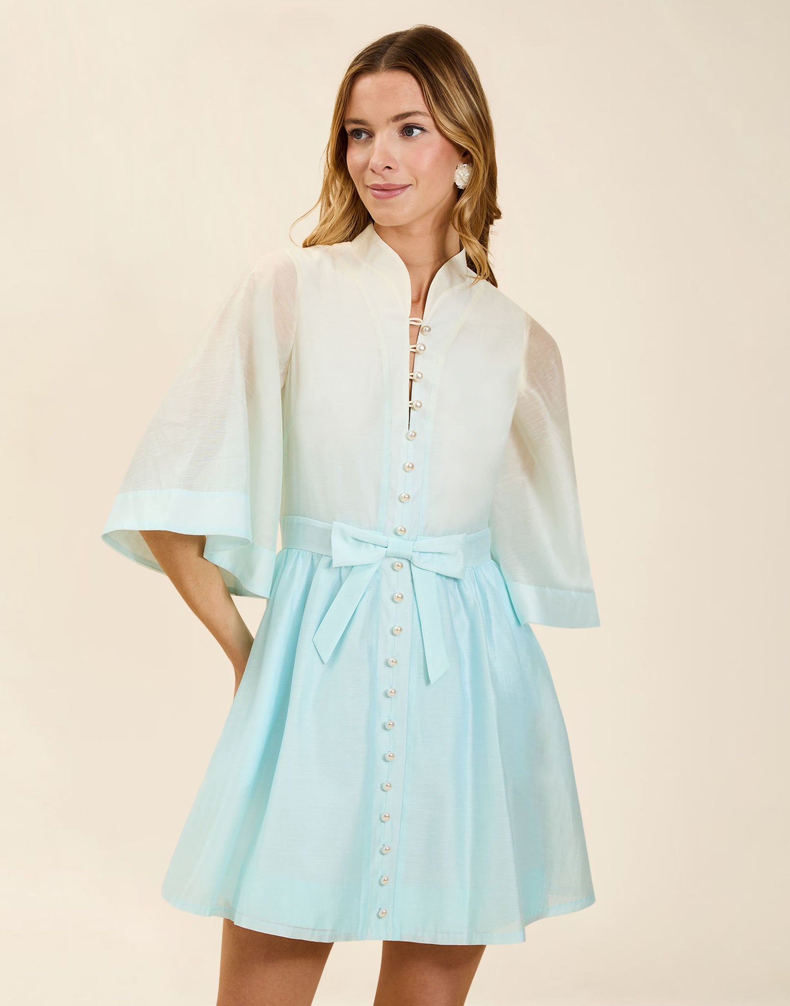 Carmen Mini Dress in Powder Ombré linen organza with mandarin collar, butterfly sleeves, bow waist detail, and fit-and-flare mini silhouette.