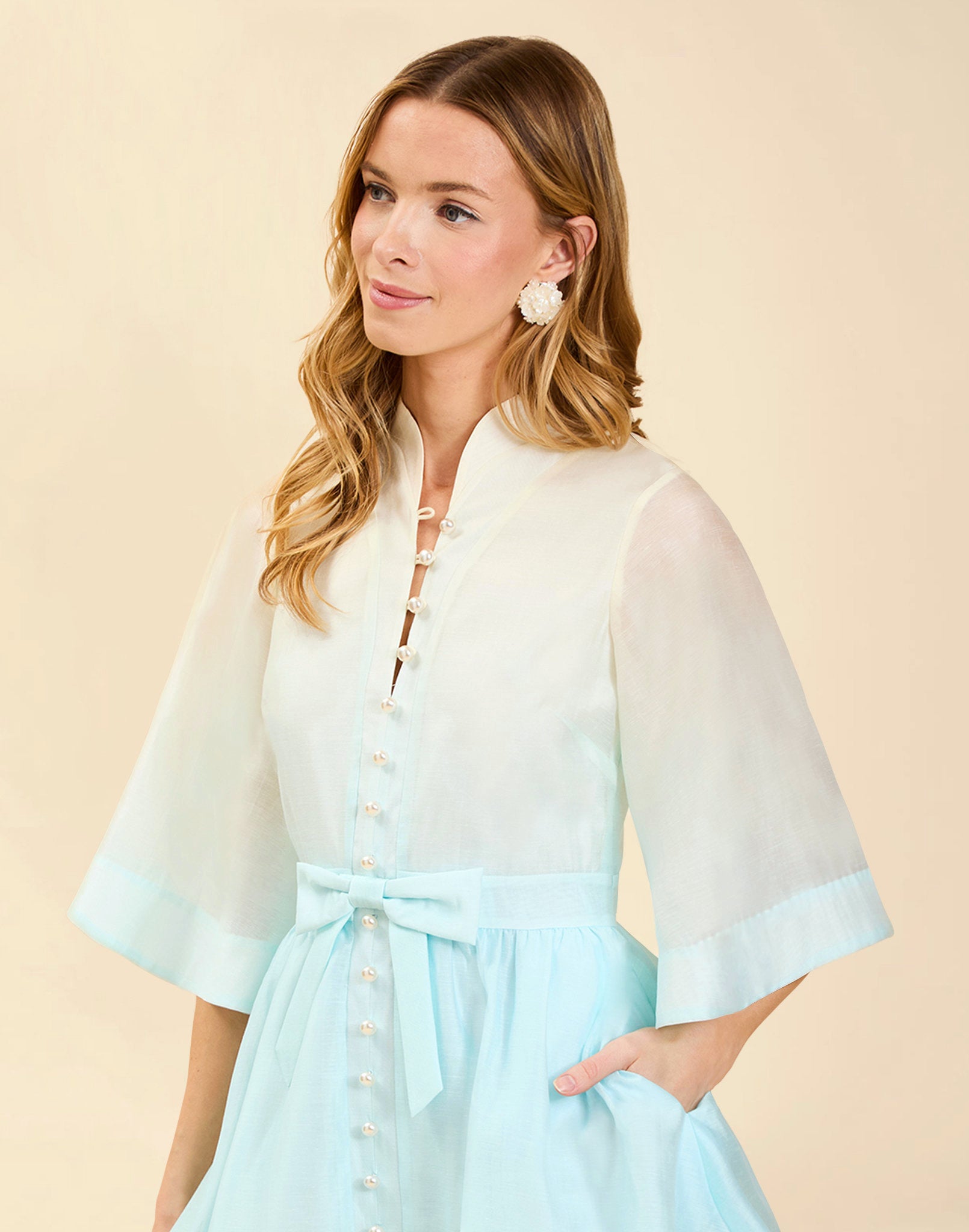 Carmen Mini Dress in Powder Ombré linen organza with mandarin collar, butterfly sleeves, bow waist detail, and fit-and-flare mini silhouette.