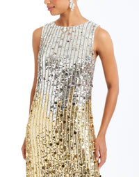 Celestina Sequin Tea Length Dress in Champagne Ombre detail – sleeveless ombre sequin evening dress with crew neckline, organza hem, and column silhouette by Mestiza New York.