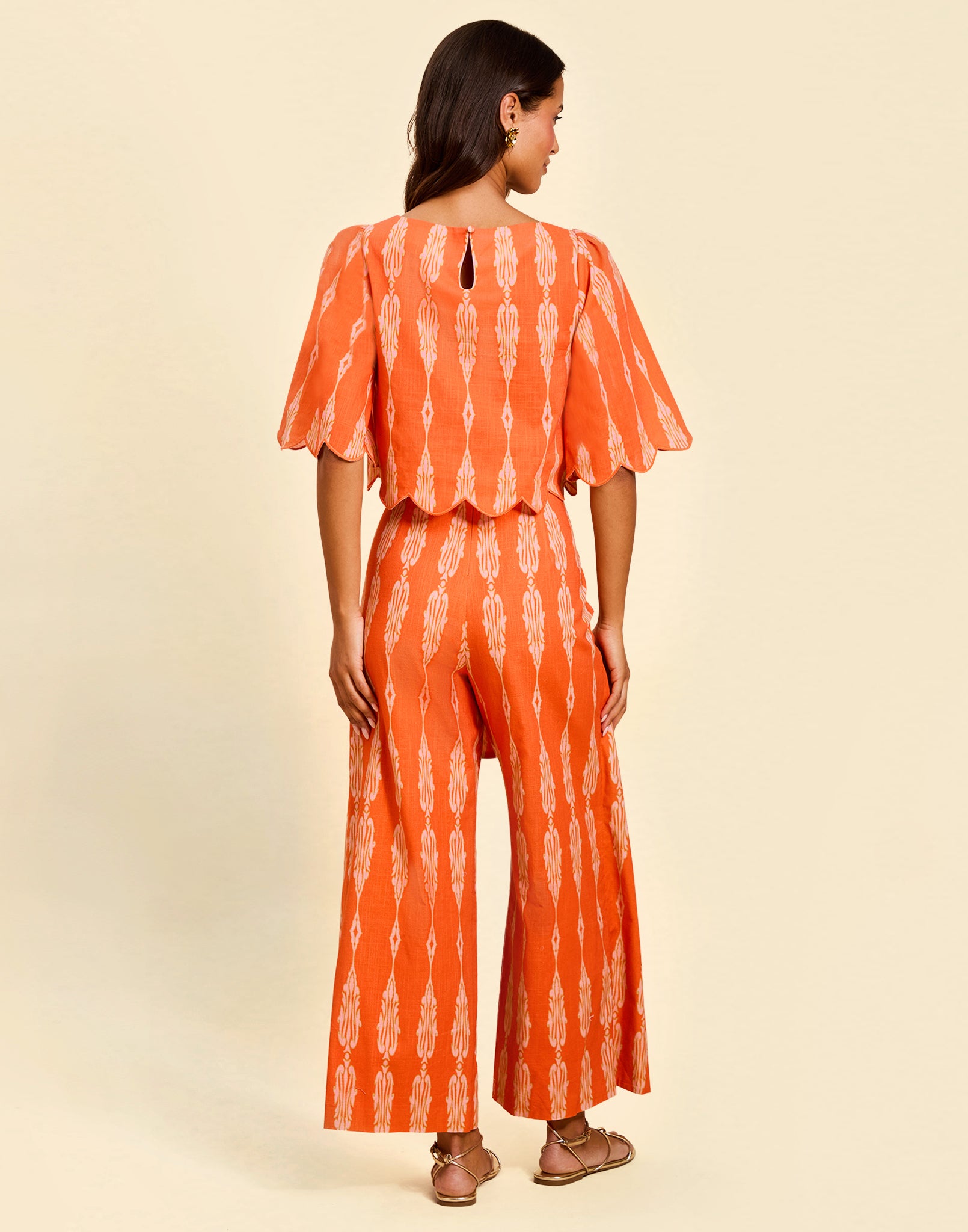 Women’s linen cropped top in Hibiscus Mosaic print with embroidered bell sleeves and scalloped detailing