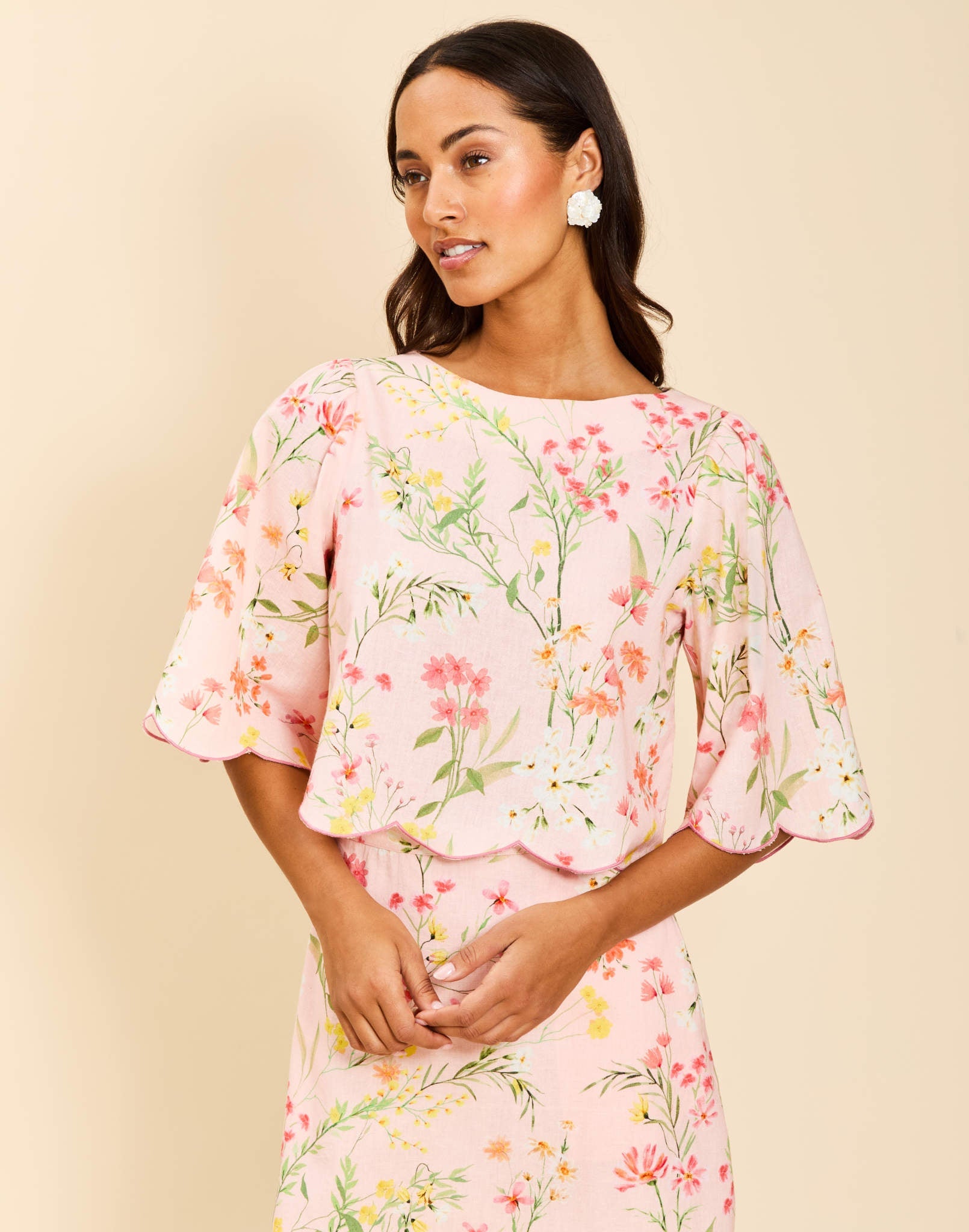 Charlize Top in Rose Vines linen with boat neckline, embroidered scalloped hem, wide bell sleeves, and relaxed silhouette.