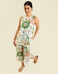 Corey Tunic Top in Groovy Florals linen with ivory banding, side slits, and a relaxed tunic silhouette.