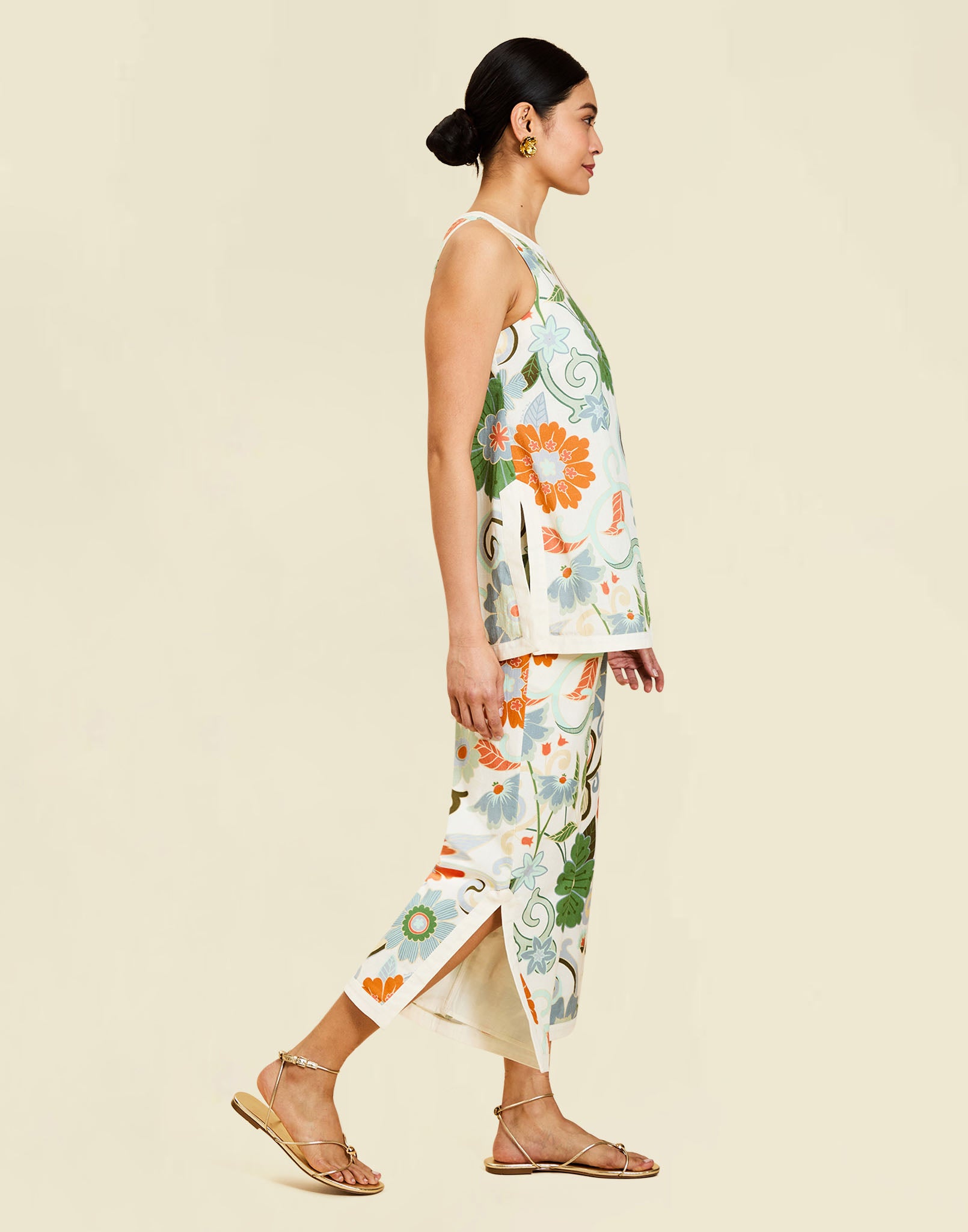 Corey Tunic Top in Groovy Florals linen with ivory banding, side slits, and a relaxed tunic silhouette.