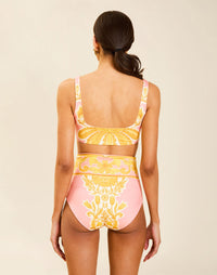 Model wearing Orvieto Convertible Bikini Bottom in Florentine Blush with foldover high-waist and reversible solid option.