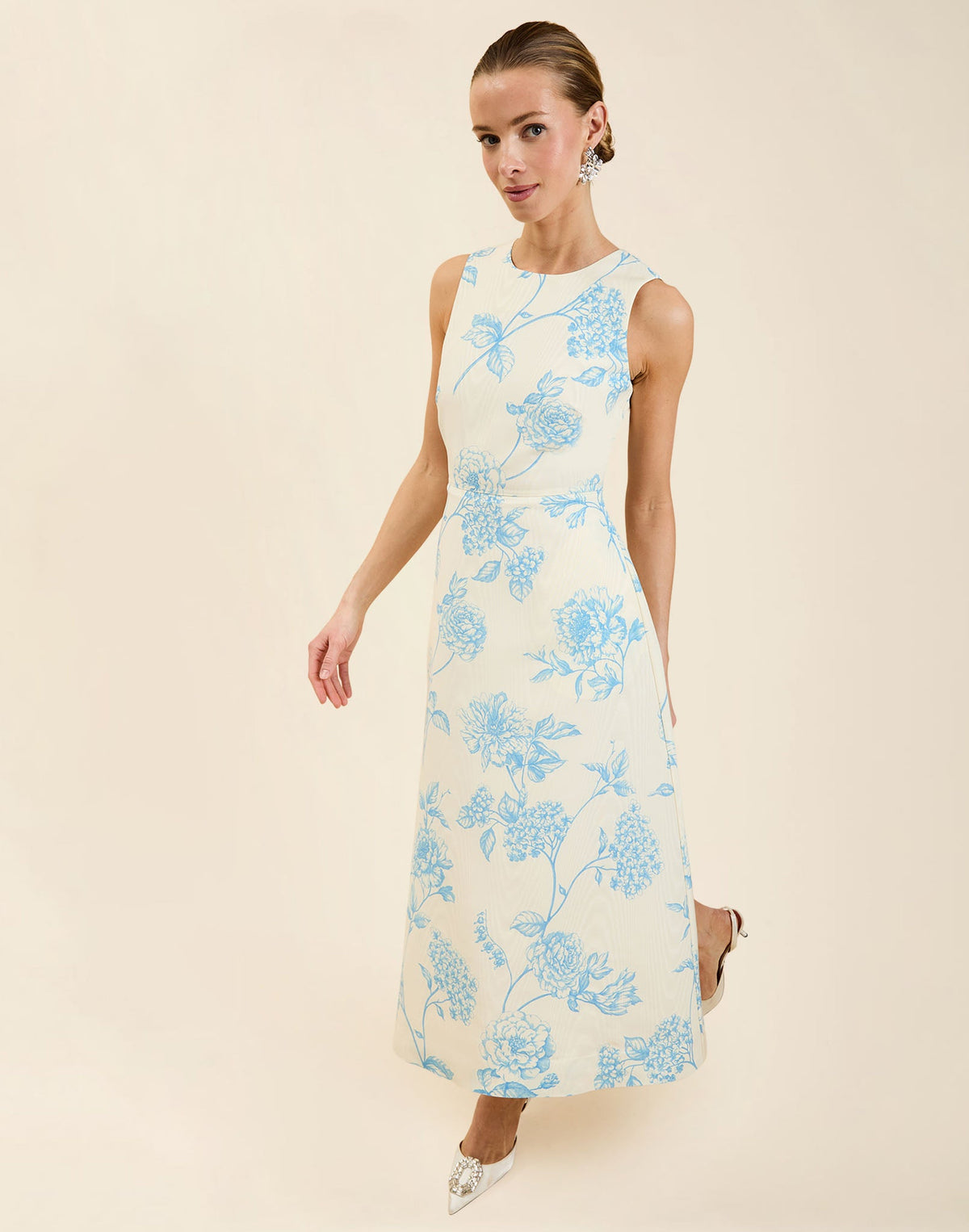 Cristobal Midi Dress in Powder Batiste moiré with crew neckline, sleeveless bodice, full A-line midi skirt, and hidden side pockets.
