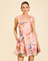 Darling Convertible Midi Dress in Seashell Symphony linen with strappy bodice, removable tiers, and convertible midi-to-mini silhouette.