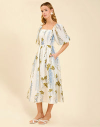 Delphine Midi Dress in Wisteria Toile with square neckline, puff sleeves, fitted bodice with back smocking, and elegant midi silhouette.