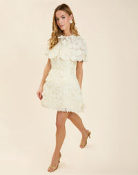 Dottie Lace Mini Dress in Ivory guipure lace with strapless neckline, structured bodice with boning, and bell-skirt mini silhouette.