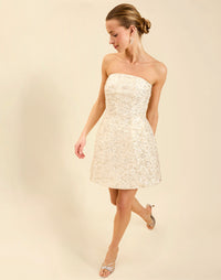 Dottie Mini Dress in Sugar Swizzle with beaded linen organza, strapless neckline, structured bodice with boning, and bell-skirt mini silhouette.