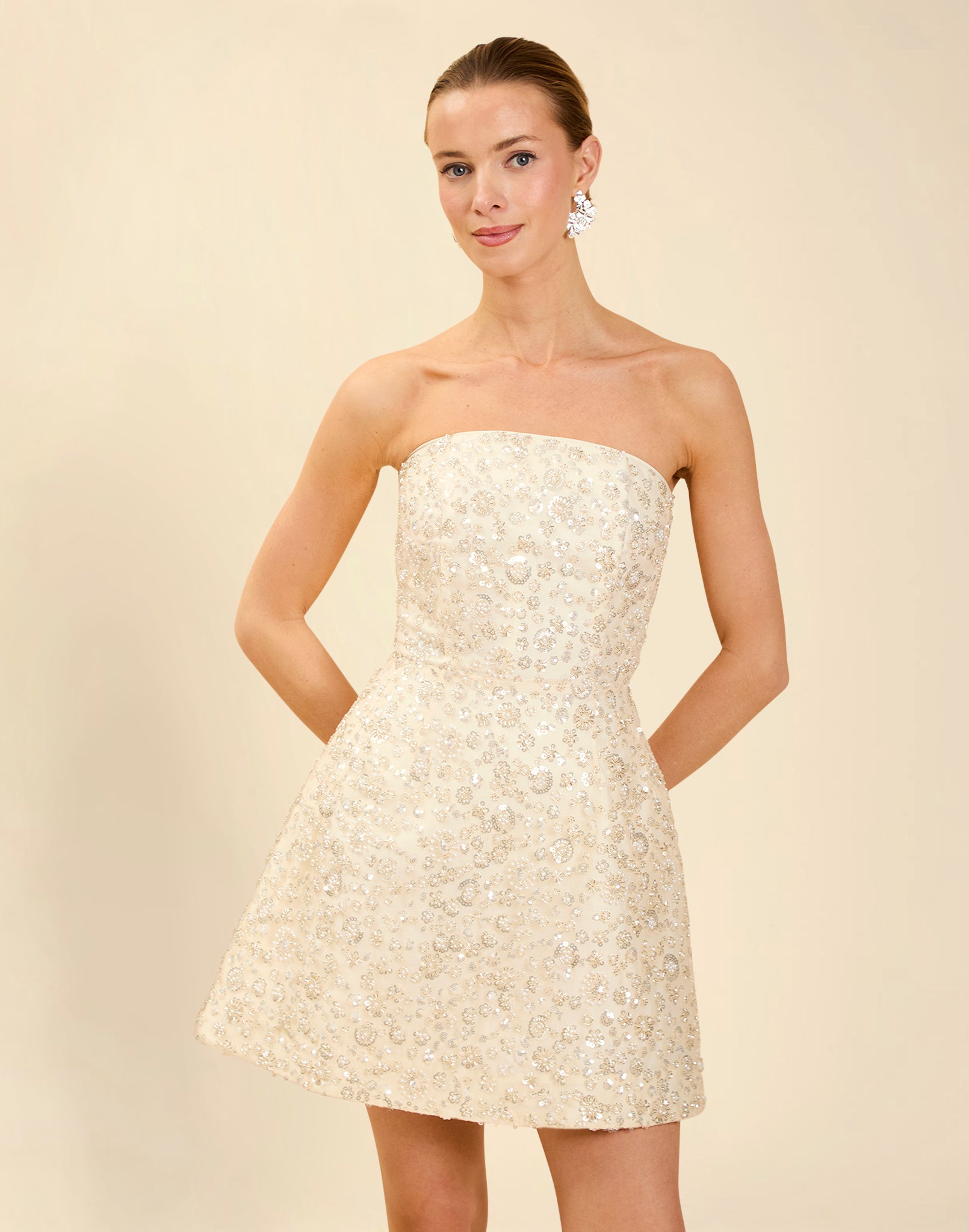 Dottie Mini Dress in Sugar Swizzle with beaded linen organza, strapless neckline, structured bodice with boning, and bell-skirt mini silhouette.