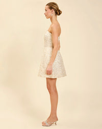 Dottie Mini Dress in Sugar Swizzle with beaded linen organza, strapless neckline, structured bodice with boning, and bell-skirt mini silhouette.