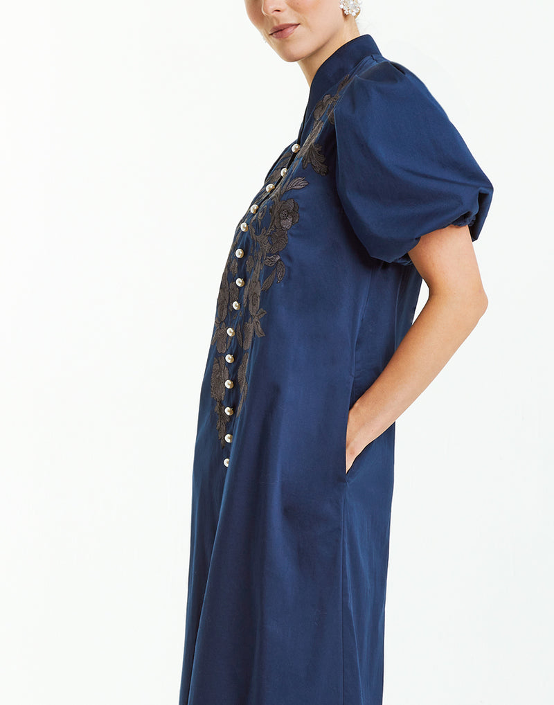 Modern barong midi dress in navy with embroidery, pearlized buttons, puff sleeves and side pockets