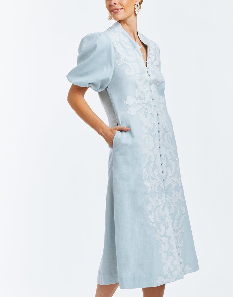 A-line midi dress with mandarin collar puff sleeves and embroidered flourishes.