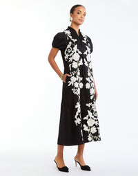 Elliana Barong Midi Dress in Black Ivory full body – embroidered A-line midi dress with puff sleeves, V-neckline, and side seam pockets by Mestiza New York.
