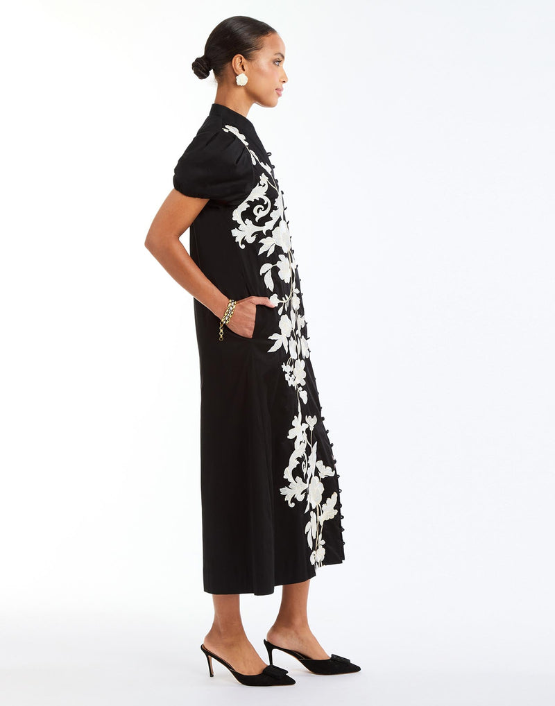 Elliana Barong Midi Dress in Black Ivory side – embroidered A-line midi dress with puff sleeves, V-neckline, and side seam pockets by Mestiza New York.
