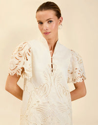 Elliana Lace Mini Dress in Ivory broderie anglaise lace with mandarin collar, pleated puff sleeves, scalloped hem, and shift mini silhouette.