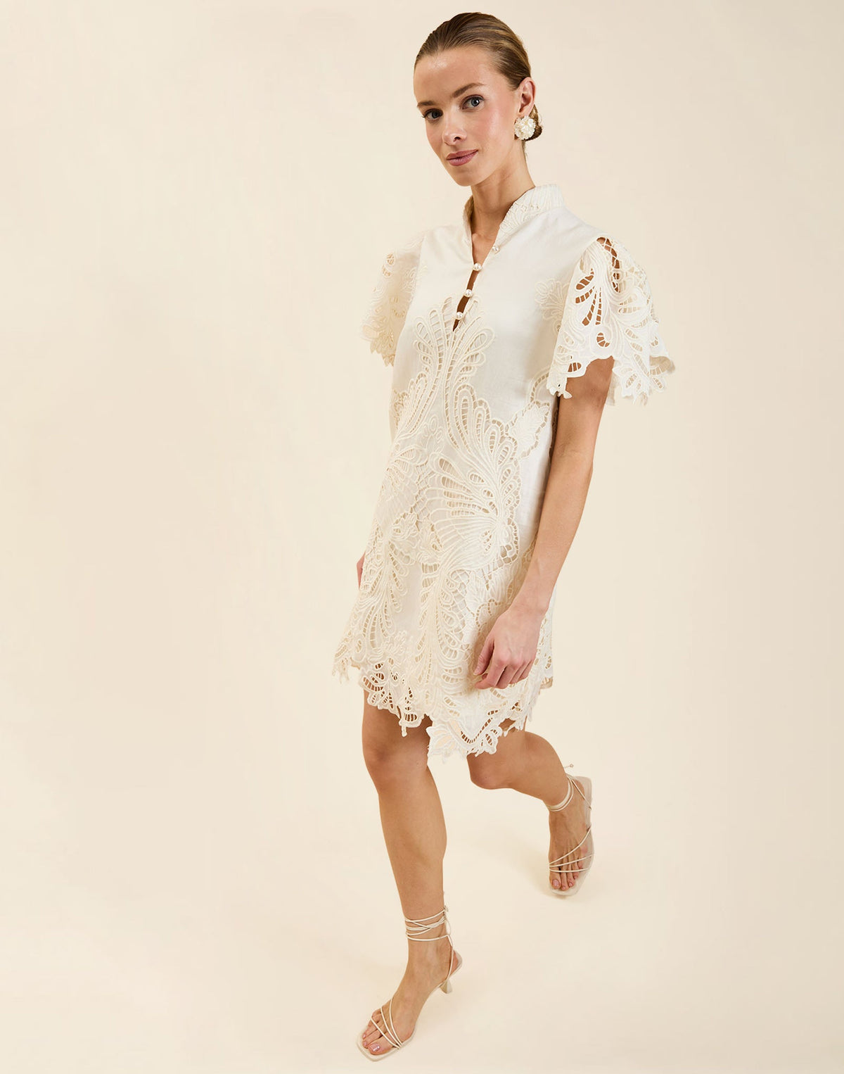 Elliana Lace Mini Dress in Ivory broderie anglaise lace with mandarin collar, pleated puff sleeves, scalloped hem, and shift mini silhouette.