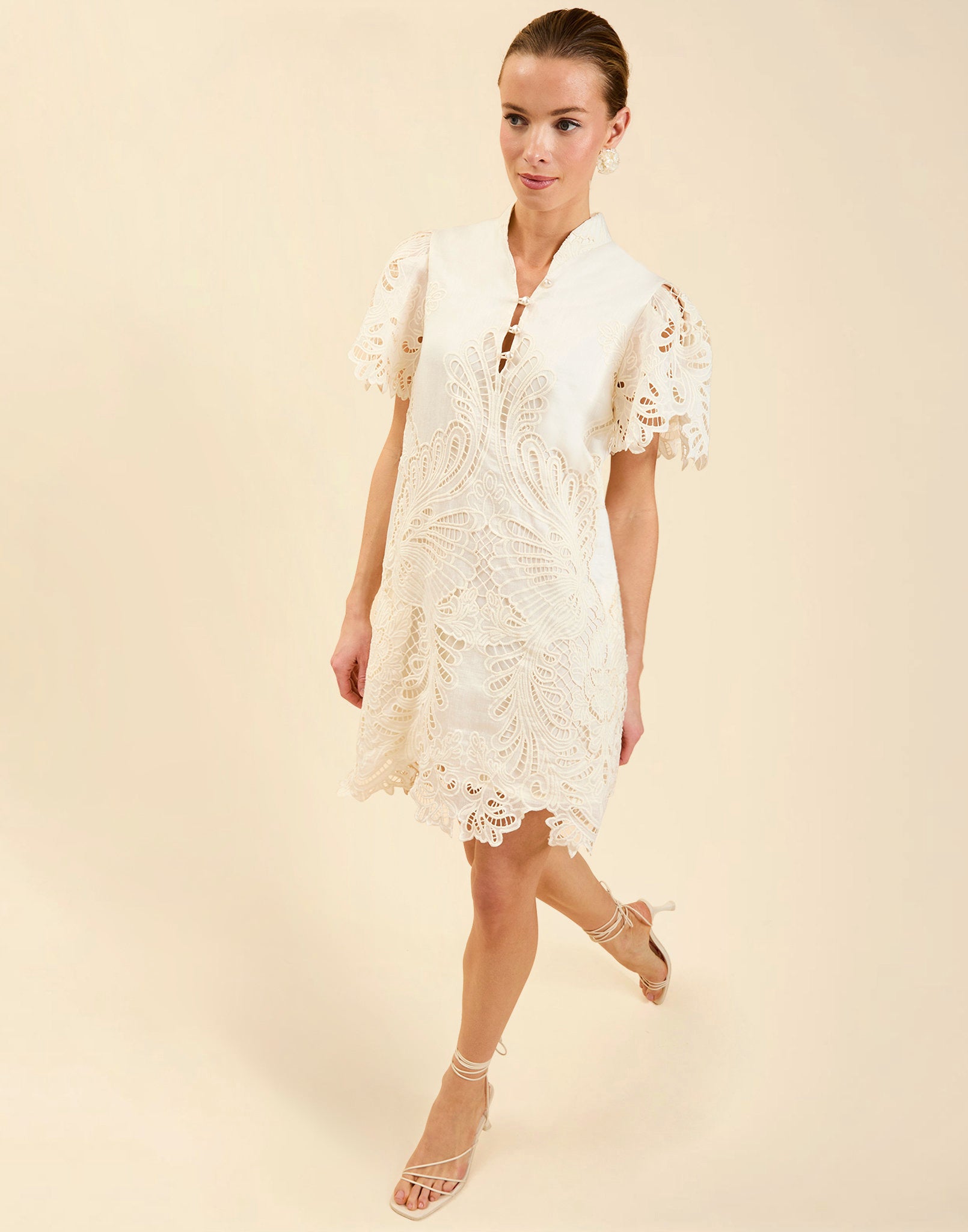 Elliana Lace Mini Dress in Ivory broderie anglaise lace with mandarin collar, pleated puff sleeves, scalloped hem, and shift mini silhouette.