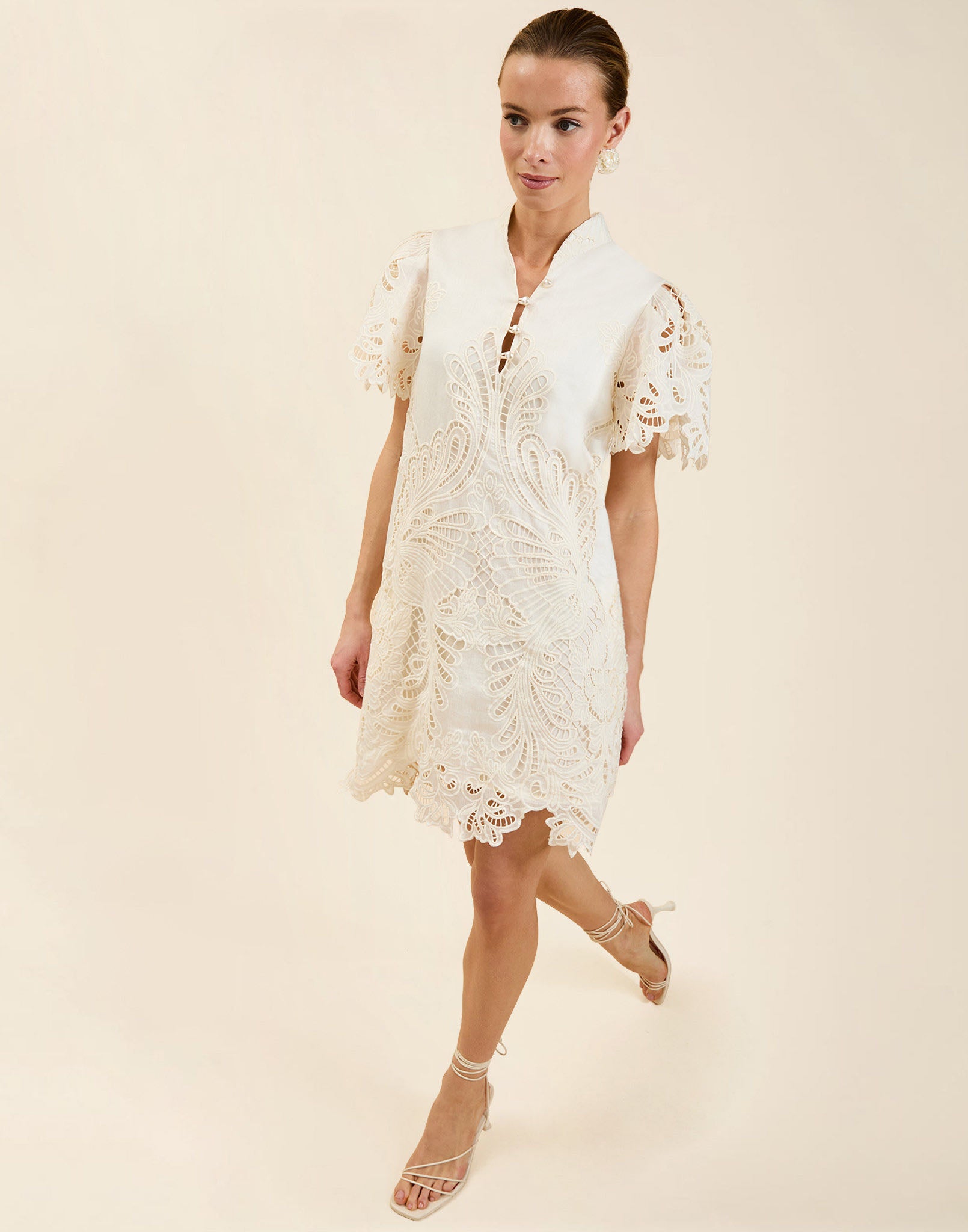 Elliana Lace Mini Dress in Ivory broderie anglaise lace with mandarin collar, pleated puff sleeves, scalloped hem, and shift mini silhouette.
