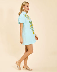 Elliana Mini Dress in Sorrento Citrus cotton poplin with barong-style lemon embroidery, mandarin collar, puff sleeves, and side pockets.