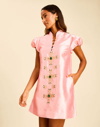 Elliana Mini Dress in Blush Tulip with a mandarin collar, pleated puff sleeves, and beading down the front.
