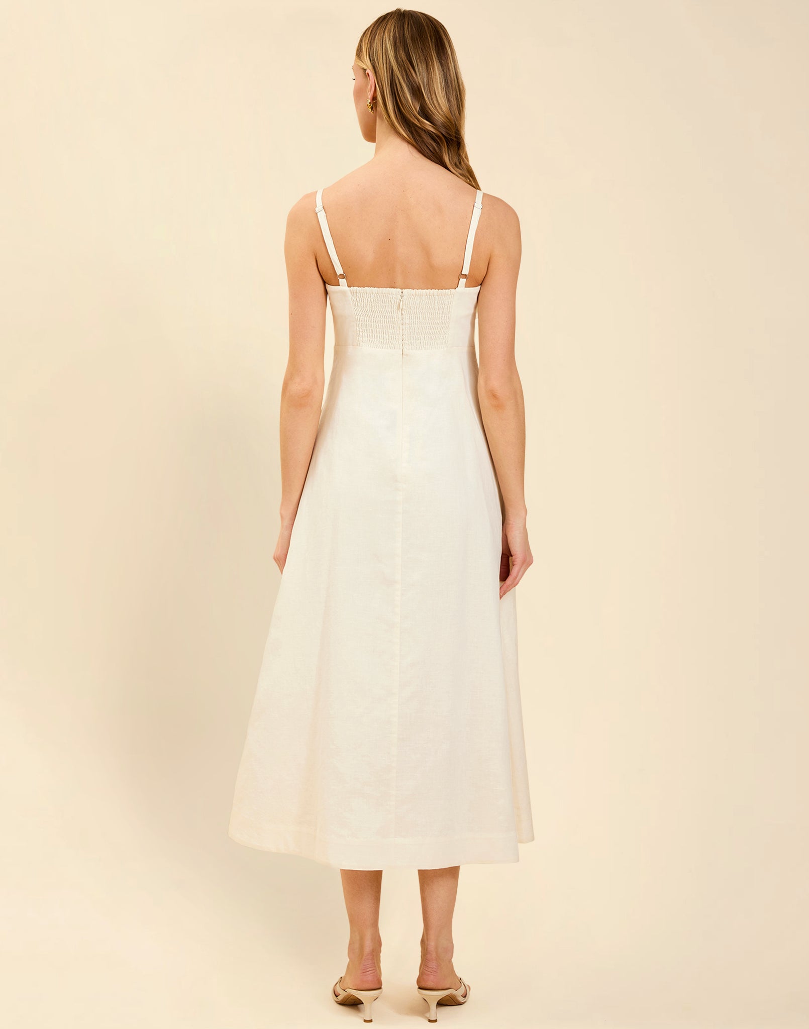 Esperanza Midi Dress in Ivory linen with 3D floral appliqué, empire bodice, adjustable straps, and elegant A-line midi skirt.