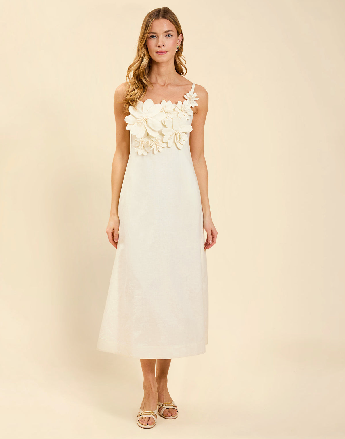 Esperanza Midi Dress in Ivory linen with 3D floral appliqué, empire bodice, adjustable straps, and elegant A-line midi skirt.