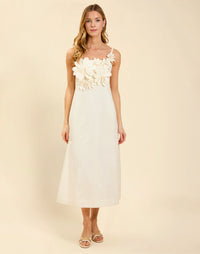 Esperanza Midi Dress in Ivory linen with 3D floral appliqué, empire bodice, adjustable straps, and elegant A-line midi skirt.