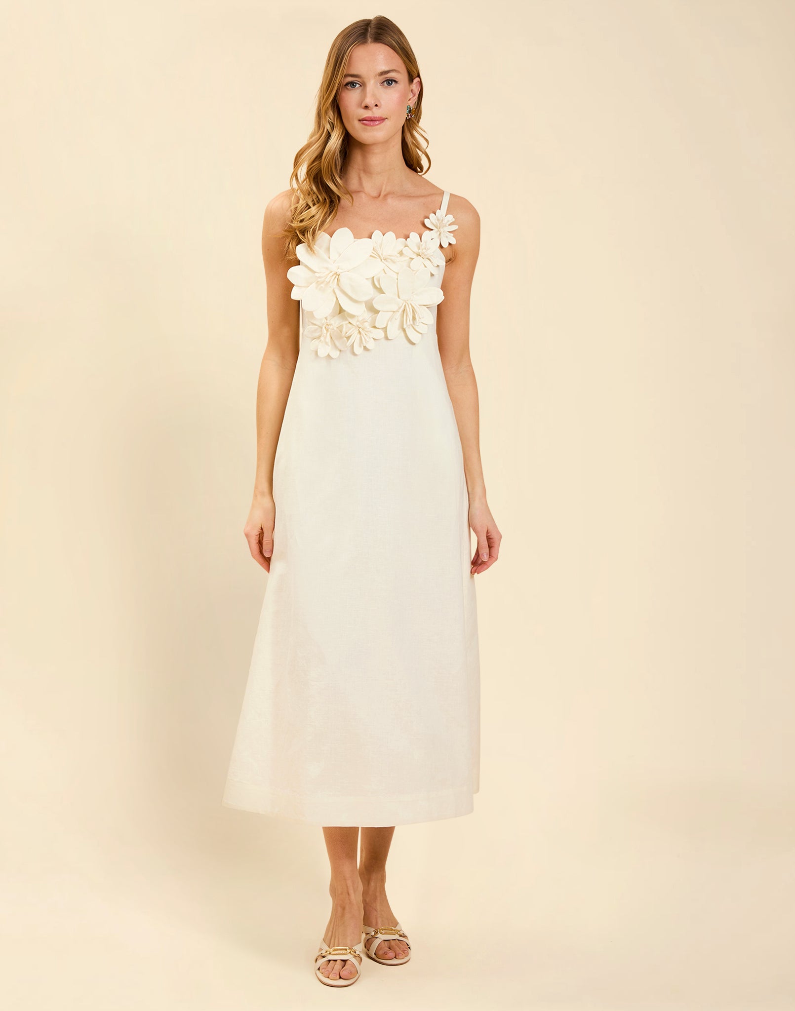 Esperanza Midi Dress in Ivory linen with 3D floral appliqué, empire bodice, adjustable straps, and elegant A-line midi skirt.