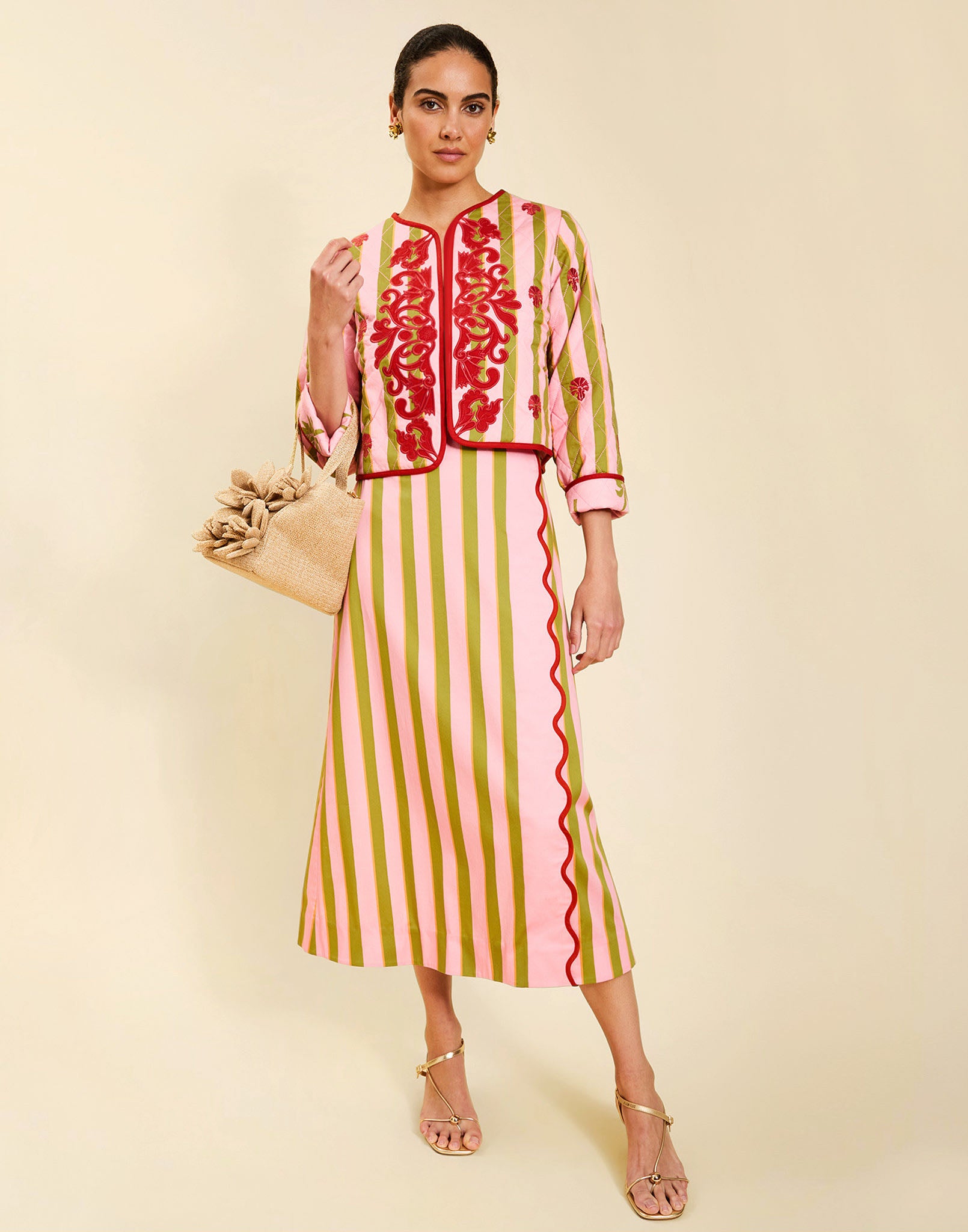 Woman wearing the Mestiza Este Convertible Jacket in Rose Provence print, featuring reversible construction, embroidered detailing, tilted diamond quilting, contrast piping, and full-length sleeves in cotton.