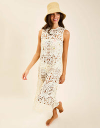Model wearing Farfalle Crochet Midi Dress in Ivory with A-line silhouette and keyhole back closure.
