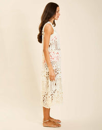 Model wearing Farfalle Crochet Midi Dress in Ivory with A-line silhouette and keyhole back closure.