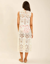 Model wearing Farfalle Crochet Midi Dress in Ivory with A-line silhouette and keyhole back closure.