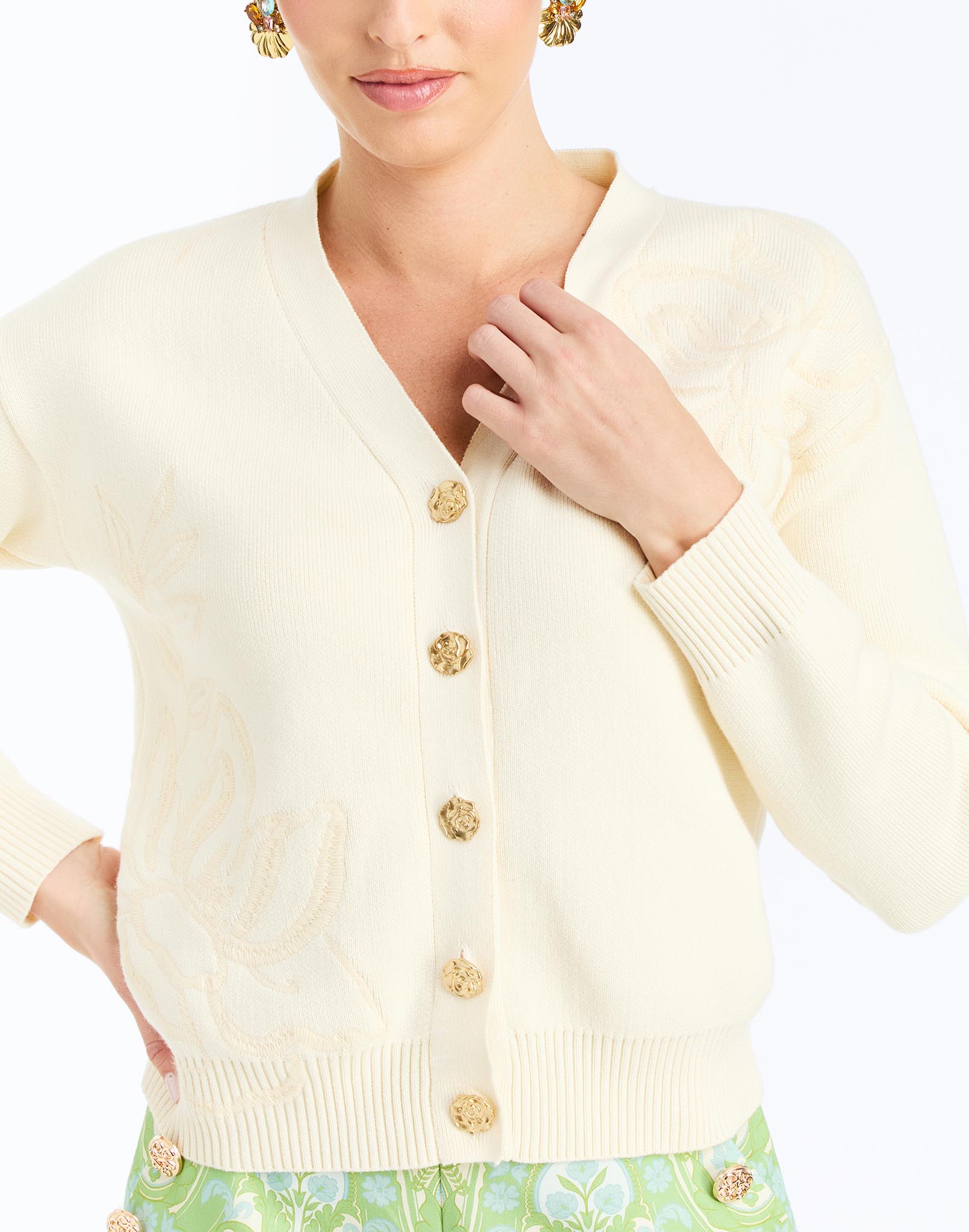 Detail - Finley Cardigan in Ivory is an oversized knit cardigan with embroidery and gold buttons.