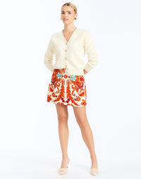 Front - Finley Cardigan in Ivory is an oversized knit cardigan with embroidery and gold buttons.