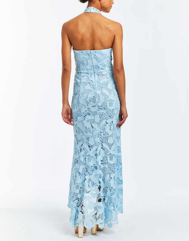 Ocean blue laser cut lace halter gown. Featuring a mermaid flare skirt with high-low scalloped hemline. 