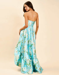 Georgiana Gown in Blue Botanica strapless poly silk twill gown with asymmetrical cascading skirt and side seam pockets.