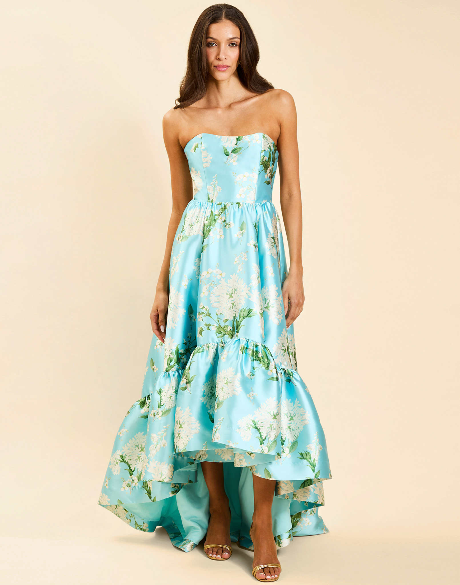 Georgiana Gown in Blue Botanica strapless poly silk twill gown with asymmetrical cascading skirt and side seam pockets.