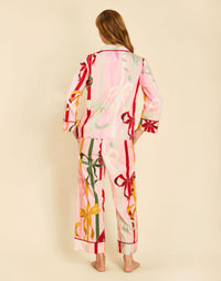 Gigi Bow Print Pajamas in Wrapped Bows with a button-front top, contrast piping, and relaxed full-length pant.