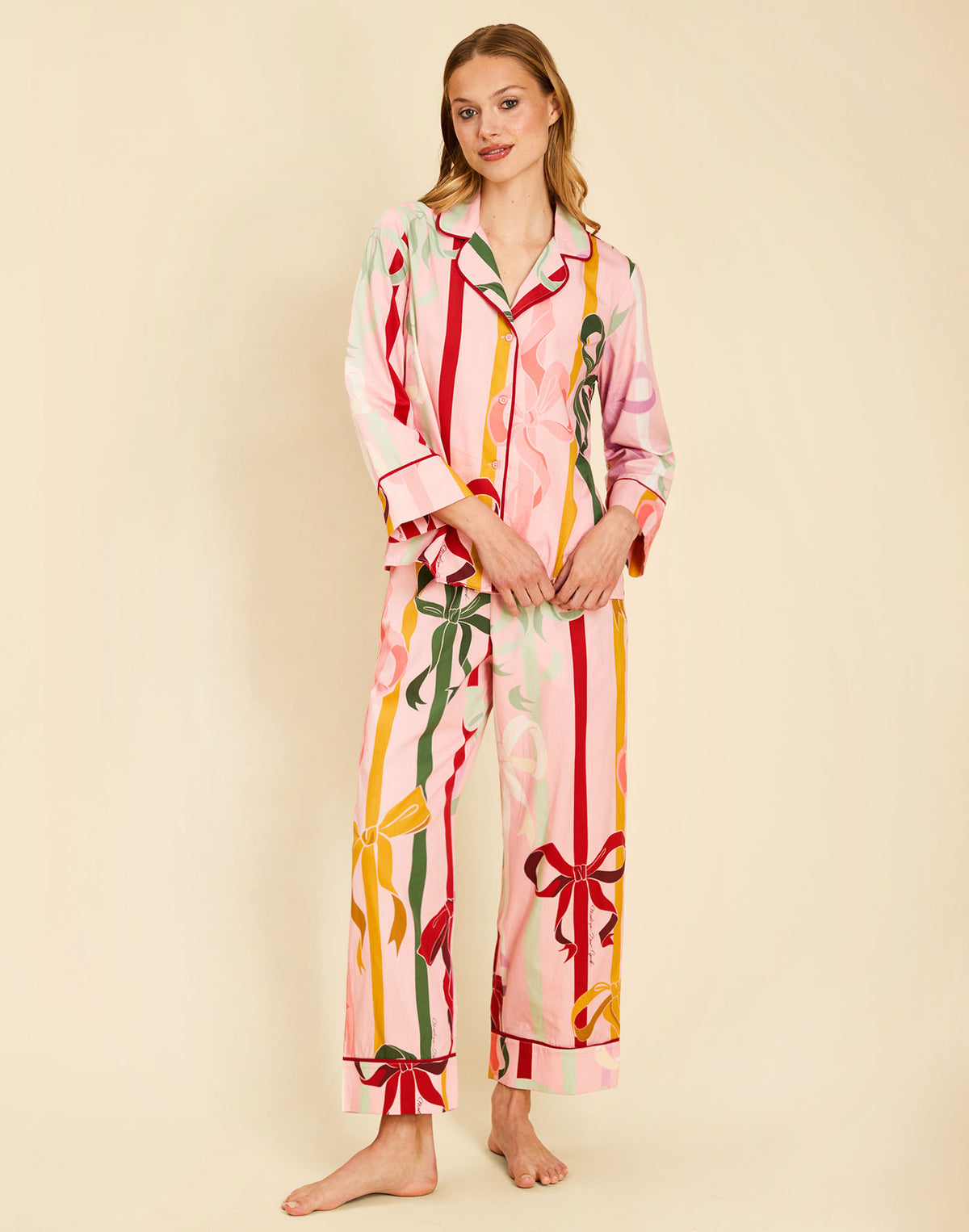 Gigi Bow Print Pajamas in Wrapped Bows with a button-front top, contrast piping, and relaxed full-length pant.