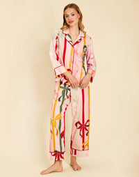 Gigi Bow Print Pajamas in Wrapped Bows with a button-front top, contrast piping, and relaxed full-length pant.