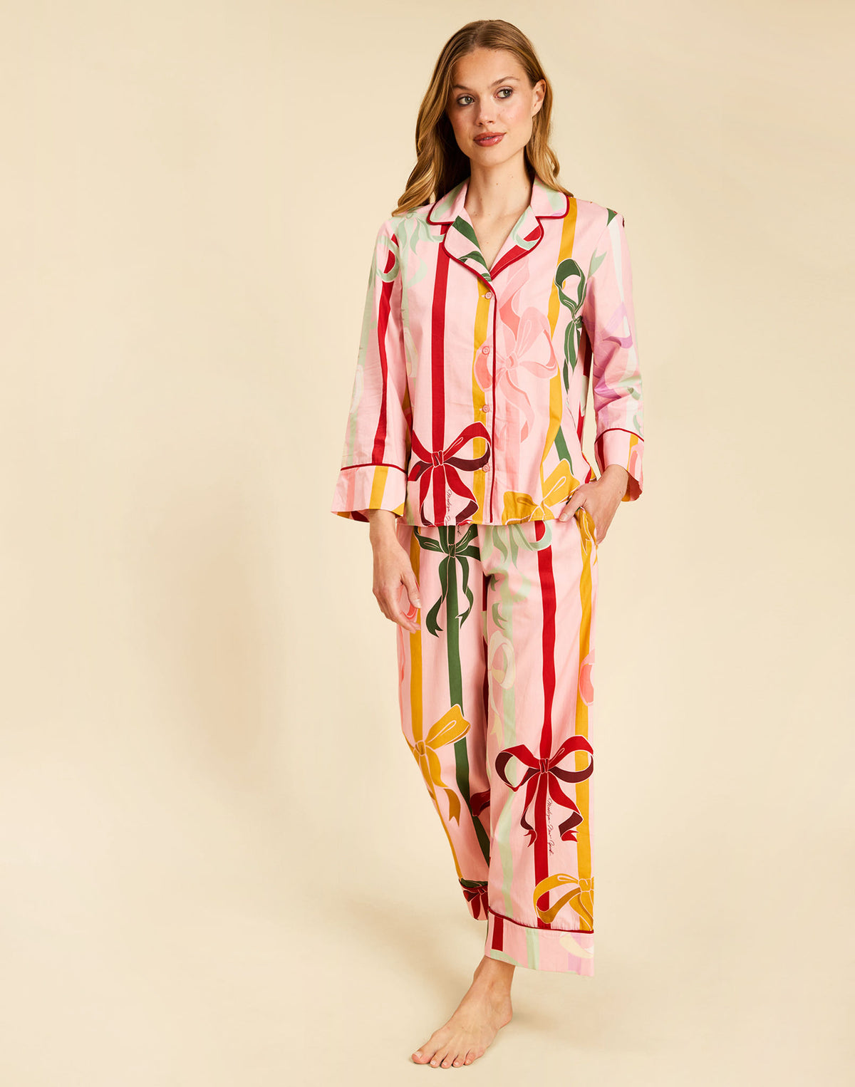 Gigi Bow Print Pajamas in Wrapped Bows with a button-front top, contrast piping, and relaxed full-length pant.